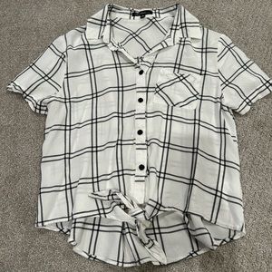 cute black and white button down with tie-knot in the front and a small pocket